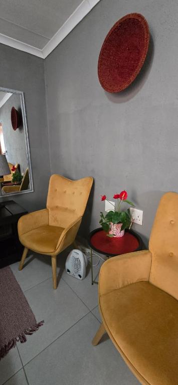 Warm sitting area with mustard armchairs